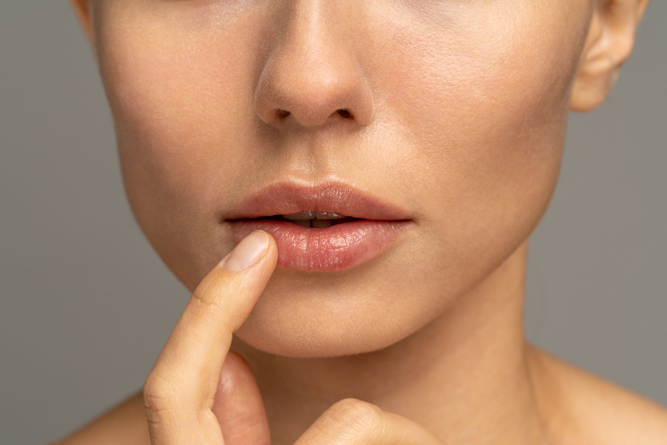 persons lips with red lipstick